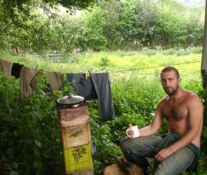 Mark Boyle (Moneyless Man) with a cup of tea, outside his caravan Date 